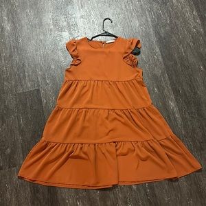 Burnt orange dress. Ruffle sleeve
